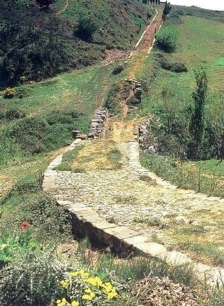 A preserved section of an ancient Roman road in Spain. There are curb stones on the sides - Ancient Rome, Road, The Roman Empire, Archeology, Building