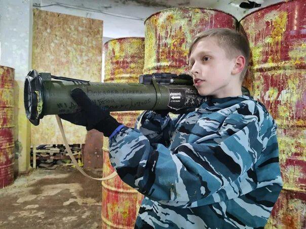 Boy playing with fire and wearing gloves - Children, Weapon, Grenade launcher, The photo