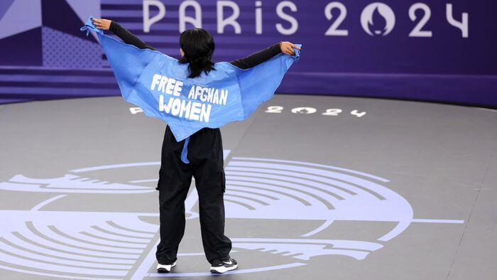 Afghan member of the refugee Olympic team was disqualified for the words Free Afghan Women displayed on her cape