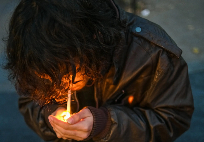 Faiz Azfar, 18, a New York University student who rolls his own cigarettes, in Washington Square Park.Credit...Dolly Faibyshev for The New York Times