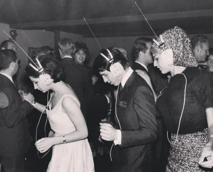 A nightclub in Paris, where everyone chooses what music to dance to by tuning it into their headphones, 1963 - The photo, Black and white photo, Paris, France, Film, 1963