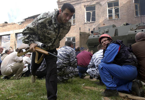 Men of Beslan, having learned that their loved ones have been taken hostage, take out their weapons and begin to gather around the school - Beslan, Negative, The photo, Courage, Men, Tragedy, Militia, North Ossetia Alania, Longpost