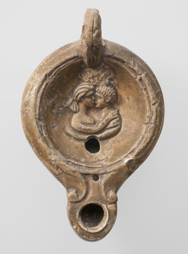 Roman clay oil lamp depicting a pair of lovers lying face to face while kissing. 1st century AD - History (science), Ancient artifacts, Rome, Ancient Rome