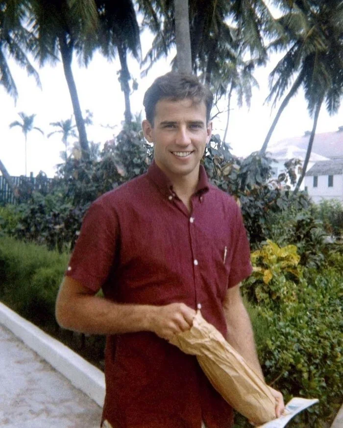 US President Joe Biden as a young man, 1960s. He holds a paper bag, apparently with some booze. - The photo, Joe Biden, USA, US presidents, 60th