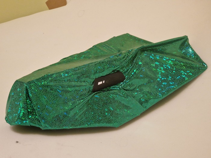 Обтянул остатками ткани, фиксировал термоклеем. Глаза сделал из бумаги, покрасил черным маркером