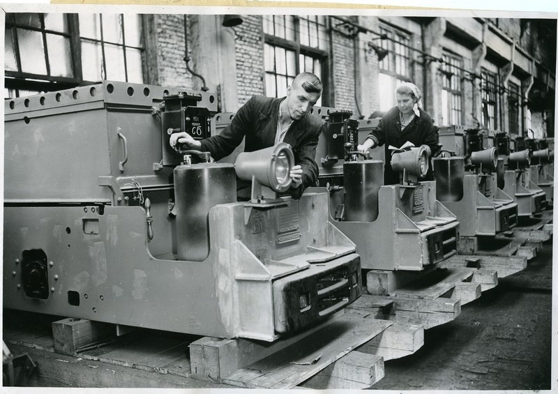 Foreman of the assembly section of the Druzhkovsky Machine-Building Plant V.I. Vasyutin checks mine electric locomotives before sending them to China. 1958 - The photo, Donbass, Druzhkovka, Factory, Electric locomotive, the USSR, Mine, China