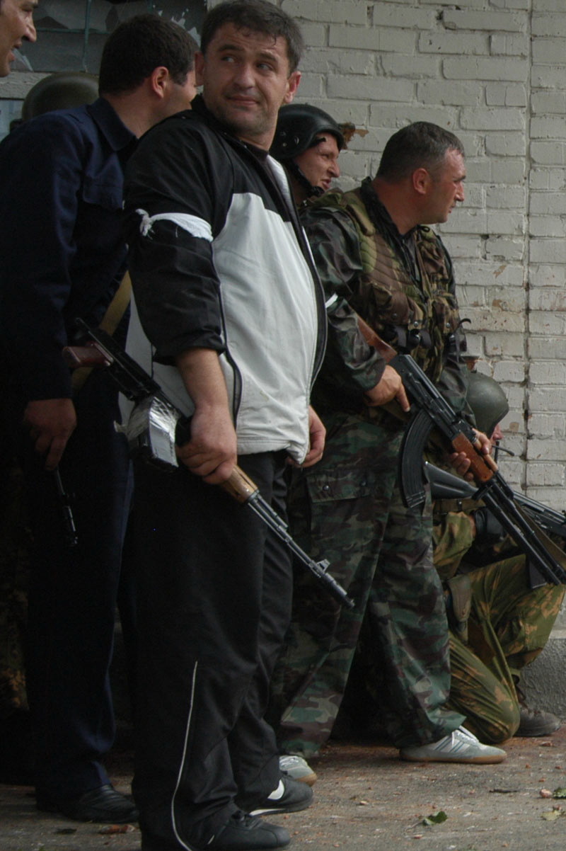 Men of Beslan, having learned that their loved ones have been taken hostage, take out their weapons and begin to gather around the school - Beslan, Negative, The photo, Courage, Men, Tragedy, Militia, North Ossetia Alania, Longpost