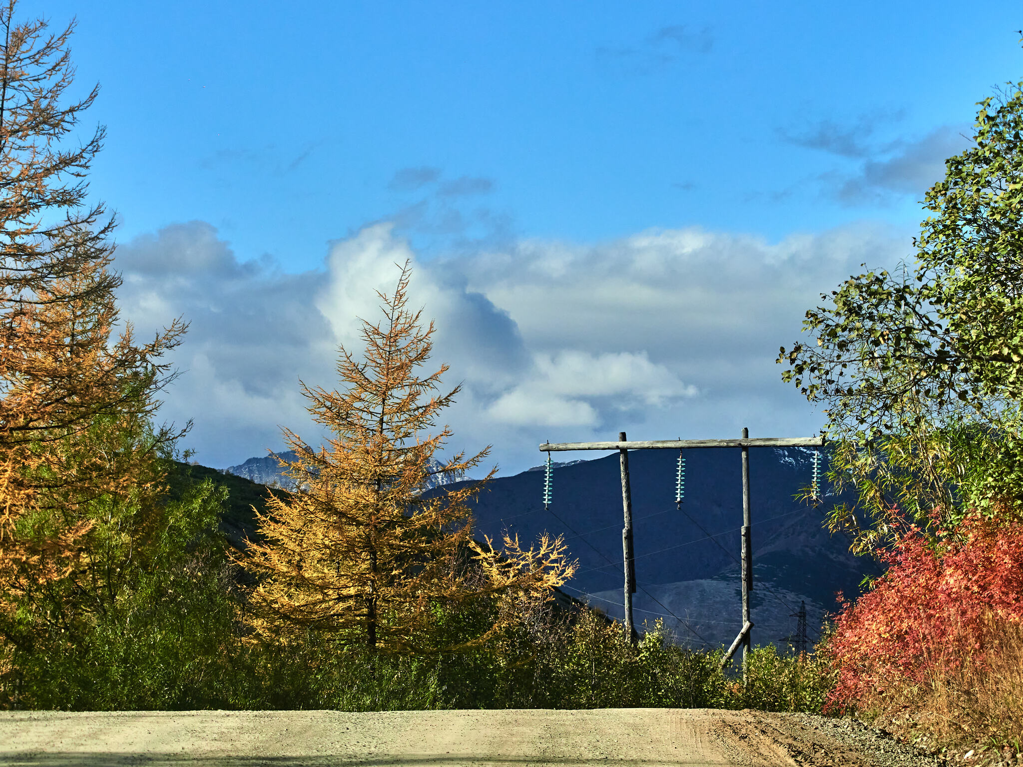 Kolyma Highway (through the car window) - My, Kolyma, Landscape, River, Mountain river, Mountain road, Forest, Taiga, The sun, Hills, The mountains, A harsh land, Beautiful view, Autumn, Clouds, Sky, Longpost